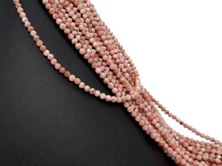 Small, faceted, pierced rhodochrosite beads