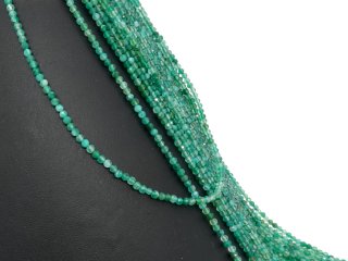 Small, drilled quartz spheres with facets in green