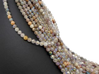 Durchbohrte, bunt schimmernde, facettierte Rutilquarz-Kugeln