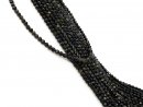 Faceted, small, pierced obsidian beads in black