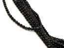 Facettierte, kleine, durchbohrte Obsidianperlen in Schwarz