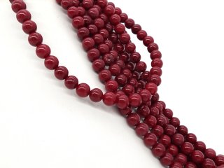 Rote, durchbohrte Quarzitkugeln