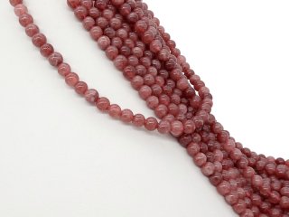 Rosafarbene, durchbohrte Quarzitkugeln