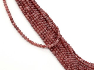 Rosafarbene, durchbohrte Quarzitkugeln