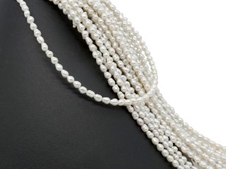 Pierced, baroque, small cultured pearls in white