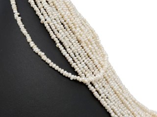 Pierced, baroque, small cultured pearls in white