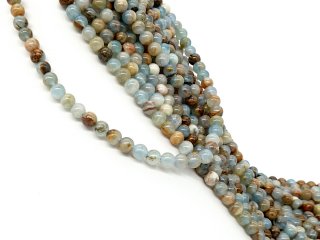 Blaue und braune, durchbohrte Calcit-Kugeln