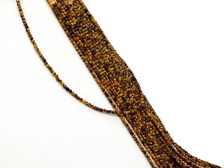 Petites perles dorées en œil de tigre à facettes