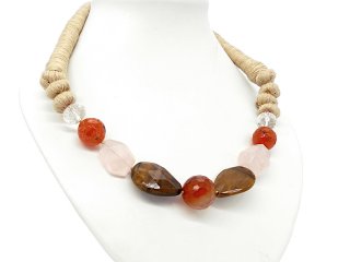 A chunky necklace made of yarn with gemstones