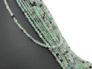 Fluorites percées, violettes, vertes avec facettes
