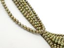 Green, cultured pearls