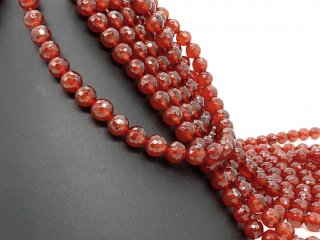 Faceted, round, pierced carnelian stones