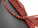 Faceted, round, pierced carnelian stones
