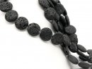 Perforated black lava stones for jewellery