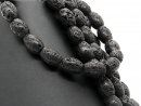 Perforated black lava stones for jewellery