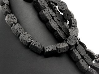 Perforated black lava stones for jewellery