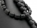 Perforated black lava stones for jewellery