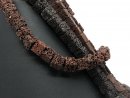 Pierced cubes made of brown lava