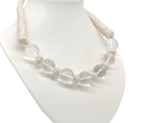 Necklace made from white yarn with large rock crystals