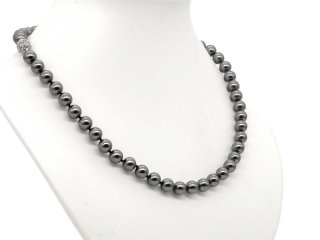 Necklace made from dark shell beads with a glittering clasp