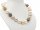 Large, elegant shell bead necklace with glittering clasp