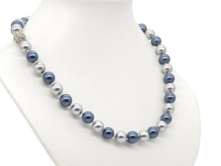 Necklace with blue and grey shell beads and glittering clasp