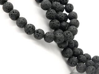Perforated black lava stones for jewellery