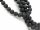 Perforated black lava stones for jewellery