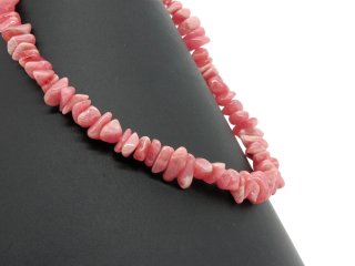 Pierced, pink-coloured rhodochrosite gemstone chips