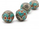 Two beads in bronze, turquoise and red