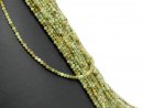 Faceted, small, pierced garnet beads in shades of green
