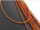 Orange-coloured, pierced garnet beads