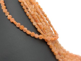 Fleurs de calcite orange percées