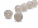 Two faceted, pierced agate beads