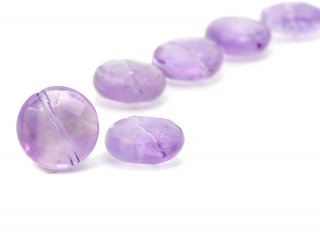 A round, faceted amethyst slice