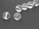Two pierced, faceted rock crystal spheres