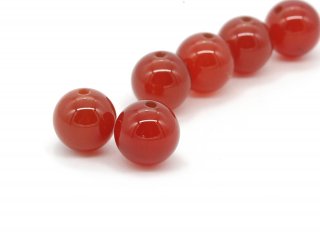 Two pierced red carnelian spheres