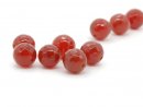 Six faceted red carnelian beads