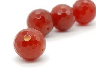 A faceted red carnelian ball
