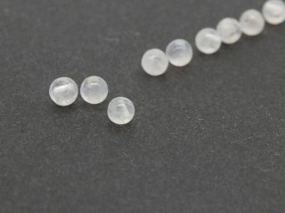 Three white pierced moonstones