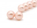 Two pierced, pink pearls