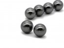 Two pierced dark grey shell pearls