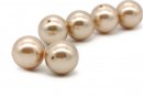 Two pastel gold shell pearls