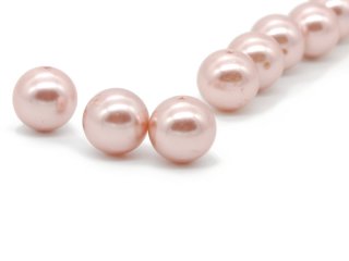 Three pink pierced beads