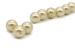 Three light yellow shell pearls