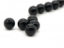 Five black pierced onyx balls