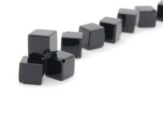 Three pierced onyx cubes