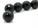 A faceted black onyx ball