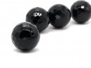 A pierced black onyx ball with facets