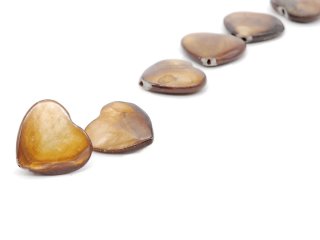 two heart-shaped mother-of-pearl discs
